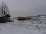 112 124 zu sehen mit einem RE in Drochaus/V. im ersten Schnee in diesem Winter am 02.12.14.