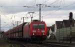 185 354-8 mit ihrem Gterzug am B 38 in Weiterstadt am 22.Feb.2014