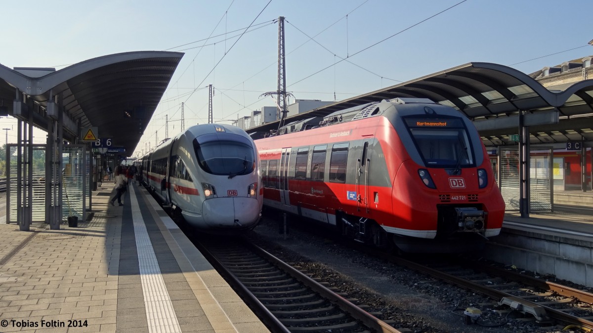 Zugkreuzung in Bamberg: Rechts am Gleis 5 steht die S-Bahn Richtung Nürnberg und links der ICE in Richtung Berlin.
Aufgenommen im April 2014.