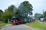 ruegensche-baederbahn/447466/99-4011-5-durchfaehrt-mit-p-108 99 4011-5 durchfährt mit P 108 den Hp.Posewald am 04.08.2015