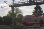ET 442 314  als RE Saxonia , noch auf alten Gleisen  hinter einer Kiefer, kurz vor Radebeul West.24.08.201316:18 Uhr